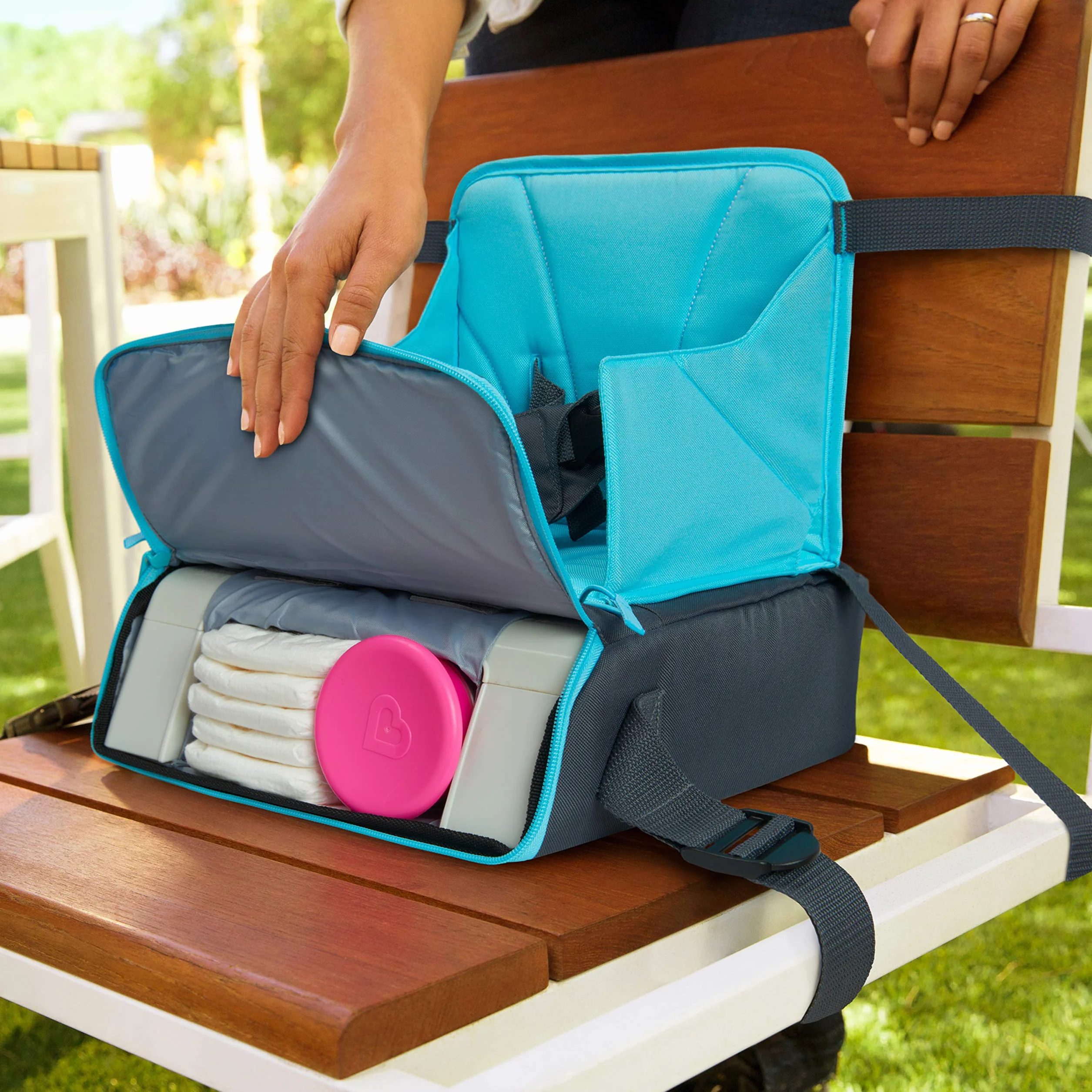 Munchkin Seggiolone portatile per bambini rialzo da viaggio si trasforma in borsa fasciatoio